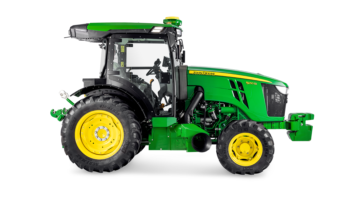 Le tracteur John Deere 5090EN de profil, soulignant la conception de la cabine et les grands pneus arrière.